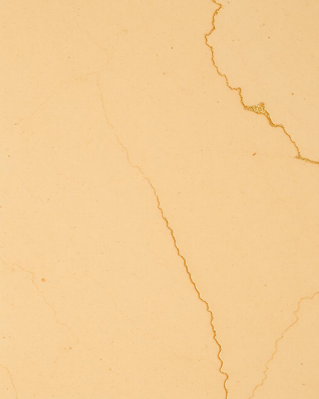 Detail of warm travertine stone with faint gold veining
